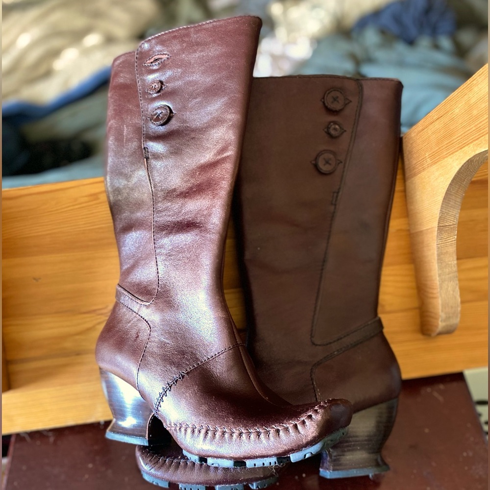- Indigo wine colored Victorian riding boots.